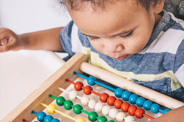 toddler playing with a toy